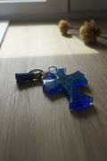 Royal blue resin cross keychain lifestyle photo
