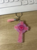 Pink and purple resin cross keychain with red heart centre, swirl detailing and pink tassel