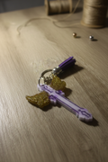 Purple angel wing cross keychain lifestyle photo