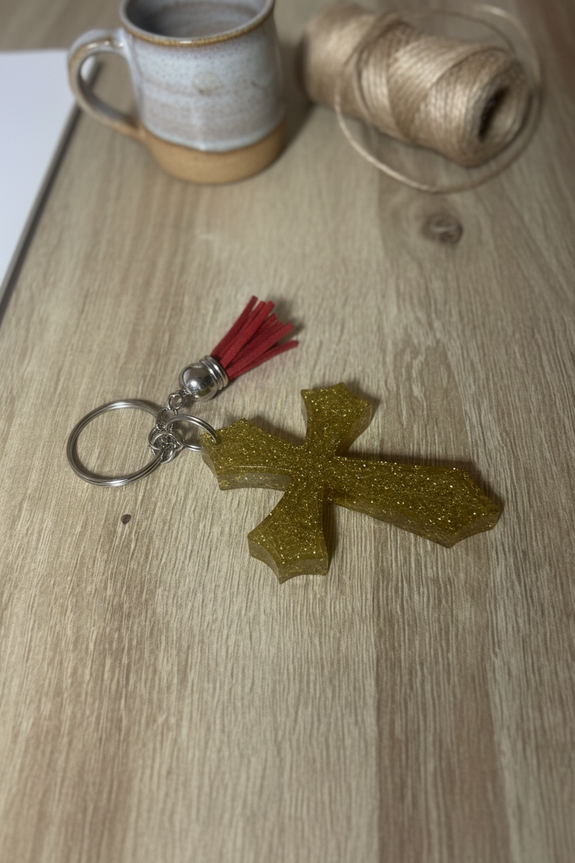 Gold glitter resin cross keychain lifestyle photo